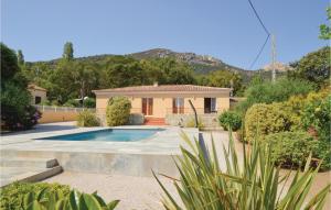 a house with a swimming pool in a yard at Awesome Home In Algajola With Wifi in Algajola