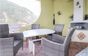 a dining room with chairs and a table and a fireplace at Helle Ferienwohnung In Elmen in Elmen