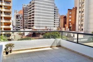 a balcony with a view of a city at Ayres de Córdoba, Gran Terraza, Excelente Ubicación in Córdoba