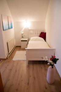 Postel nebo postele na pokoji v ubytování Apartments Marie B