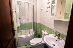 a bathroom with a toilet and a sink and a shower at 500 Meters from Grate Beach, App 10 in Ulcinj