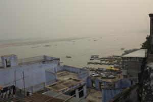 a view of the water and boats in a harbor at Shiva lodge in Varanasi