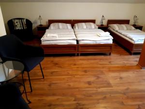 
Postel nebo postele na pokoji v ubytování Penzion V Podzámčí Litomyšl

