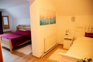 Posteľ alebo postele v izbe v ubytovaní Apartments Marie B