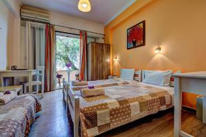 Postel nebo postele na pokoji v ubytování Marilena Apartments & Studios