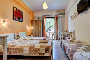 Postel nebo postele na pokoji v ubytování Marilena Apartments & Studios + 37 fotografií