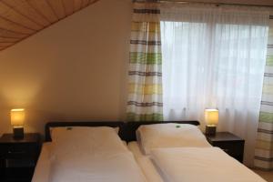 Postel nebo postele na pokoji v ubytování Gästehaus am Sonnenberg