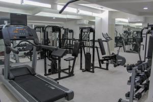 a gym with a bunch of treadmills and machines at Hotel Marina Resort & Beach Club in Santa Cruz Huatulco