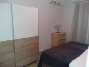Postel nebo postele na pokoji v ubytování House apartments Ariamare