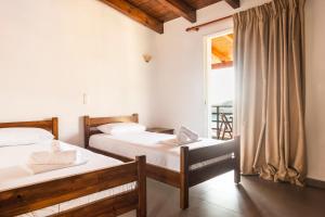 Postel nebo postele na pokoji v ubytování Margarita Guesthouse