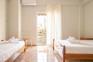 Postel nebo postele na pokoji v ubytování Margarita Guesthouse