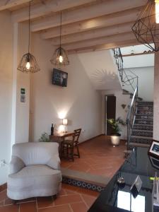 a living room with a couch and a table at Hotel Del Valle in Tecozautla