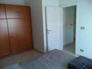 Postel nebo postele na pokoji v ubytování House apartments Ariamare