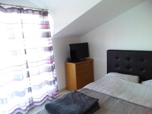 Postel nebo postele na pokoji v ubytování House apartments Ariamare