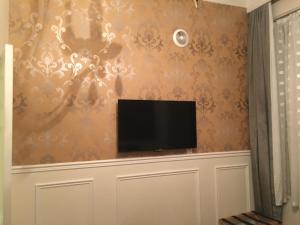 TV a/nebo společenská místnost v ubytování Parc Suites Hotel