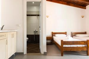 Postel nebo postele na pokoji v ubytování Margarita Guesthouse