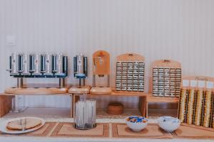 a table with bowls and other items in a room at Rooms Nadia in Stara Baška