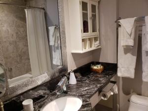 Koupelna v ubytování Parc Suites Hotel