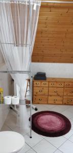 a bathroom with a sink and a toilet in a room at Wohnung Auerand in Nienhagen