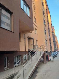 a stairway leading to an apartment building at Luxury Daniel Apartament Residence Militari in Roşu