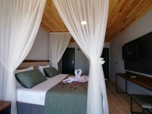 A bed or beds in a room at Royal Villa