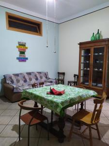 a living room with a table with chairs and a couch at Casa 900 in Pompei +43 photos