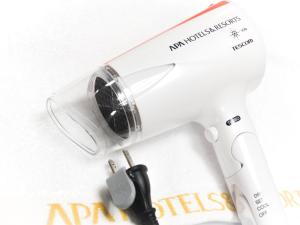a white electric hair dryer with a wire at APA Hotel Shin Osaka Ekimae in Osaka