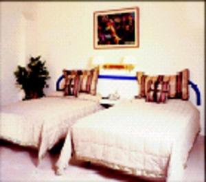 Postel nebo postele na pokoji v ubytování Hotel Sta Lucía