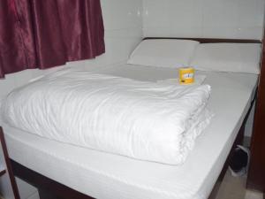 Voodi või voodid majutusasutuse Pay-Less Guesthouse (7/F A9) toas
