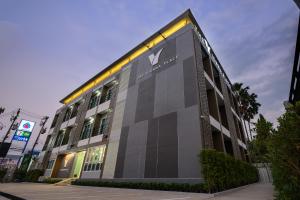 a building with a large screen on the side of it at The Vienna Place in Loei