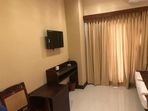 Postel nebo postele na pokoji v ubytování MercuryFM 101 Yarl Mercury Inn - Jaffna