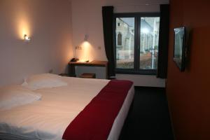 Uma cama ou camas num quarto em Hotel Carpinus