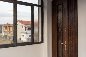 an open door with a window in a room at C'era una volta room in Case Nuove