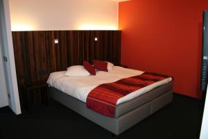 Uma cama ou camas num quarto em Hotel Carpinus