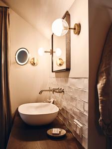 a bathroom with a bowl sink and a mirror at Krenn in Pürgg