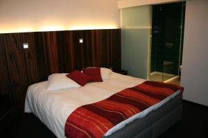 Uma cama ou camas num quarto em Hotel Carpinus