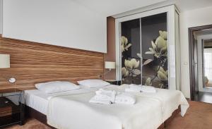 Posteľ alebo postele v izbe v ubytovaní Hotel Diva SPA