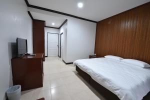 Posteľ alebo postele v izbe v ubytovaní AT TP HOTEL