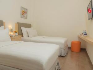 Letto o letti in una camera di d'primahotel Airport Jakarta 1