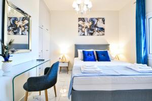 Ένα ή περισσότερα κρεβάτια σε δωμάτιο στο Koukounari Luxury Apartments
