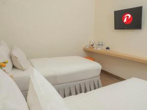 Letto o letti in una camera di d'primahotel Airport Jakarta 1