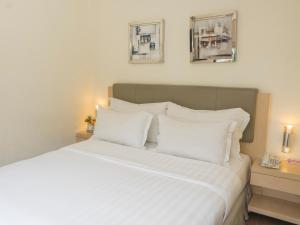 Letto o letti in una camera di d'primahotel Airport Jakarta 1