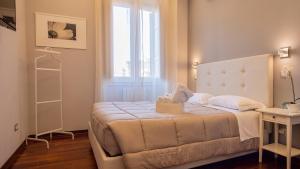 Postel nebo postele na pokoji v ubytování Borghese Executive Suite