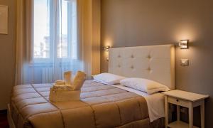 Postel nebo postele na pokoji v ubytování Borghese Executive Suite