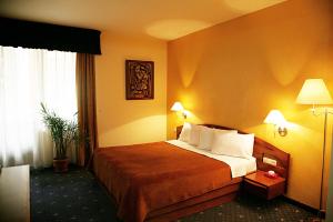 Voodi või voodid majutusasutuse Ararat Hotel toas