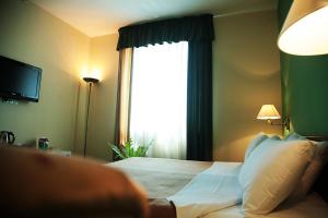 Voodi või voodid majutusasutuse Ararat Hotel toas