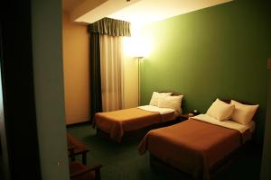 Voodi või voodid majutusasutuse Ararat Hotel toas