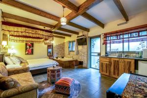 a living room with a bed and a kitchen at צימרים טרה נוסטרה in Had Nes +18 photos