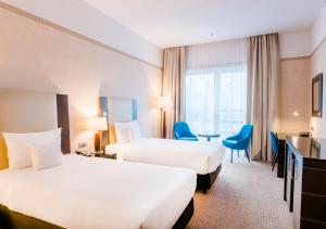 Cama ou camas em um quarto em Hotel Polonia Palace