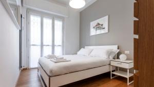 A bed or beds in a room at Italianway - Palladio 16